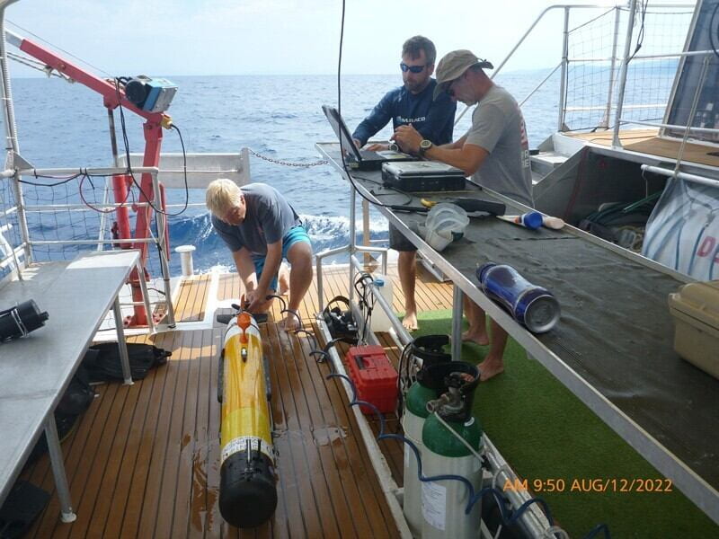 University of Delaware’s Mark Moline (left), professor of marine studies, rinses the AUV after its survey in Croatia while Matthew Breece, research scientist, and Erik White, senior engineer, download and analyze the data. Photos courtesy of Evan Kovacs and Elizabeth Snyder